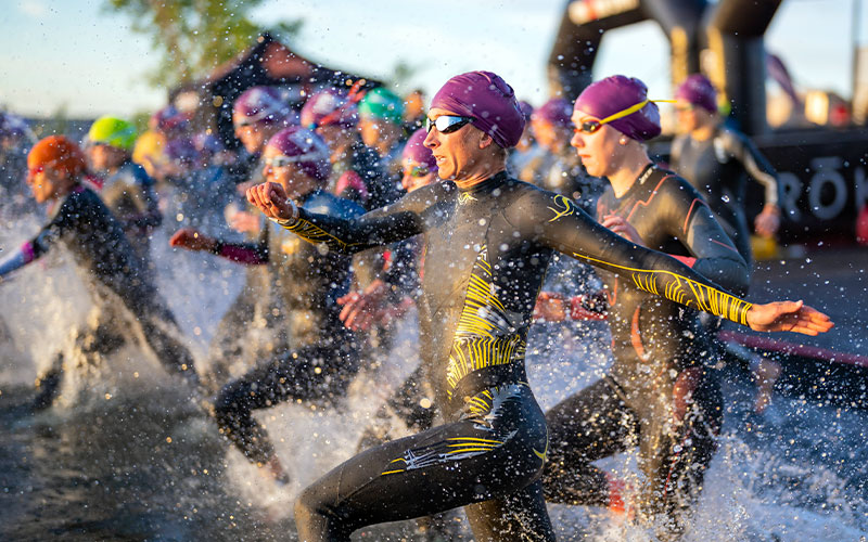 Athletes compete in the swim portion during the IRONMAN 70.3 in St George, Utah