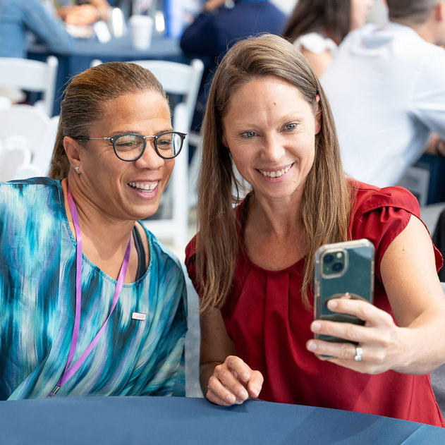 NGB Summit attendee taking a selfie.with board member, April Holmes